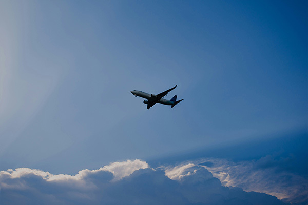 A commercial airliner flying through the sky.